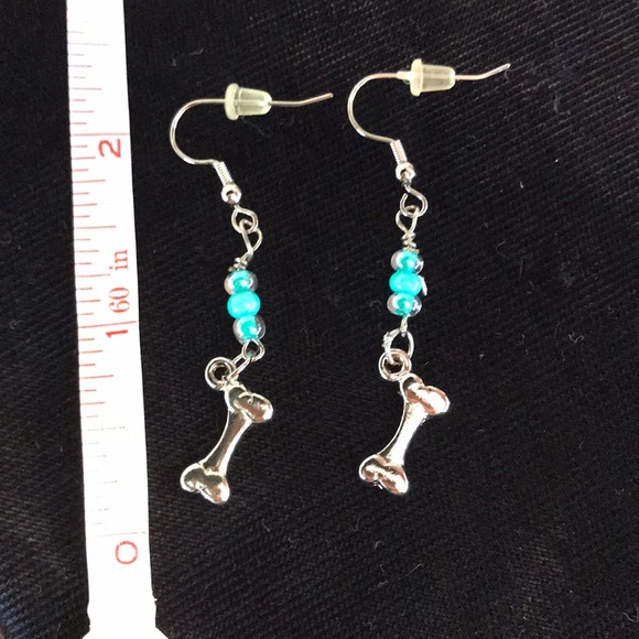 Jewelry - Silver color and green dog bone earrings